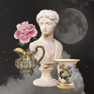 a bust statue a flower a pot and a vase in front of a moon and clouds